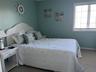 Carpeted bedroom with baseboards
