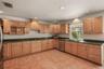 Well-appointed kitchen with new 2024 appliances and solid surface countertops