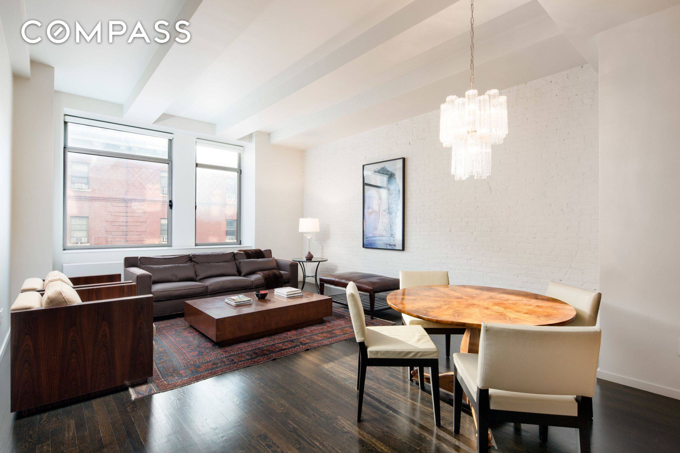 Heart of Chelsea renovated condo loft with 2 beds and baths featuring dark hardwood floors, Calcutta marble counters walnut kitchen cabinets with Viking and SubZero appliances, library den foyer space, ...