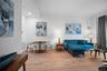 Living room featuring light wood finished floors, crown molding, baseboards, and recessed lighting