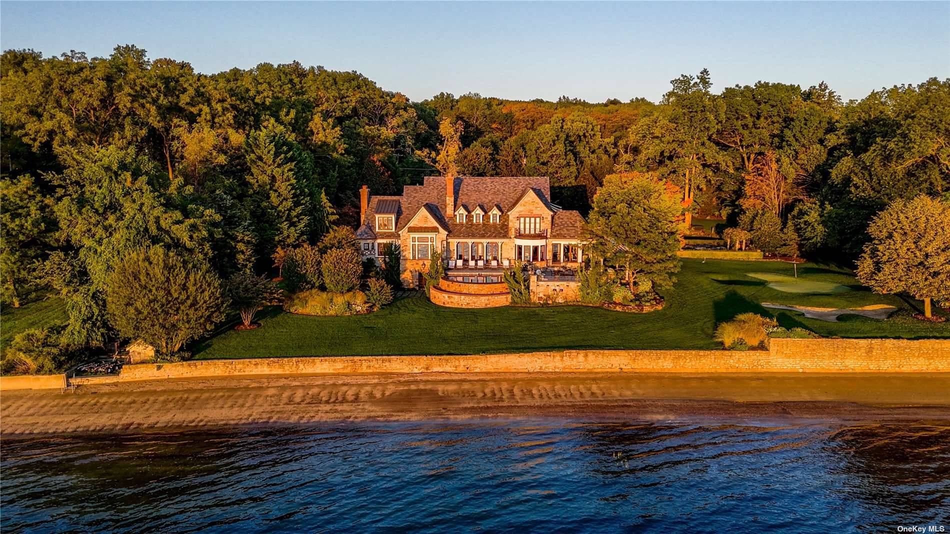 Overlooking picturesque Oyster Bay Harbor, this stately waterfront Manor home is located on 1.