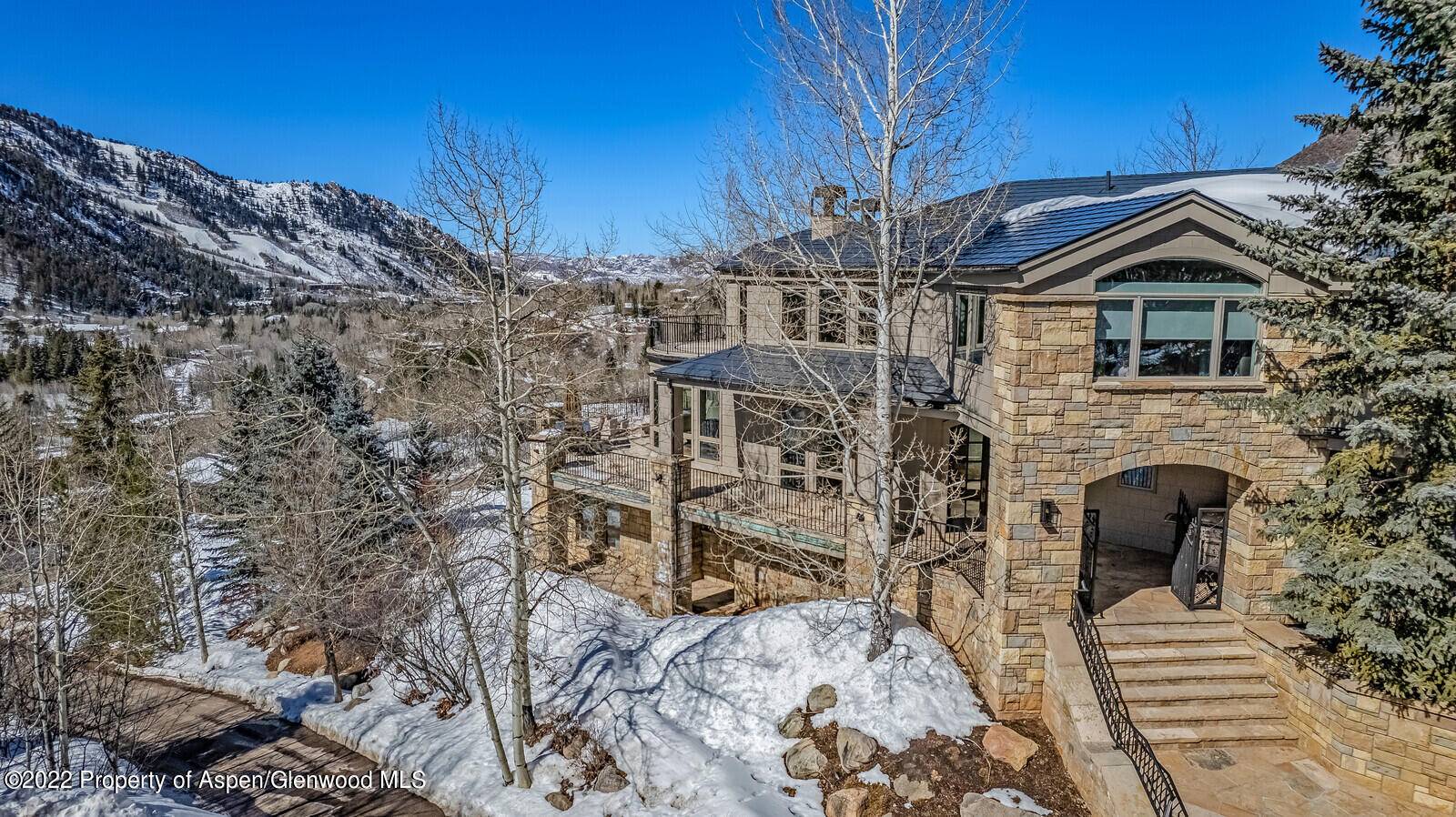 Nestled in a serene aspen grove and surrounded by mature evergreens, this luxurious private mountain estate on one of Mountain Valley's largest lots has spectacular panoramic views spanning across the ...