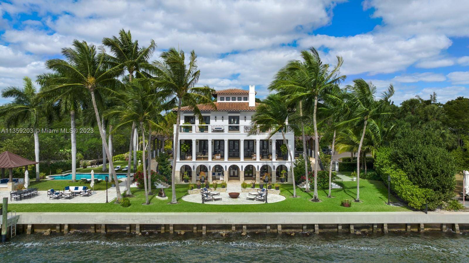 Perfectly set on a ½ acre, bayfront estate, this 3 story Villa is the epitome of sophisticated Miami living.