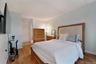 Light wood-finish flooring complements the pale blue wall paint