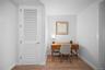 Home office featuring light wood finished floors and baseboards