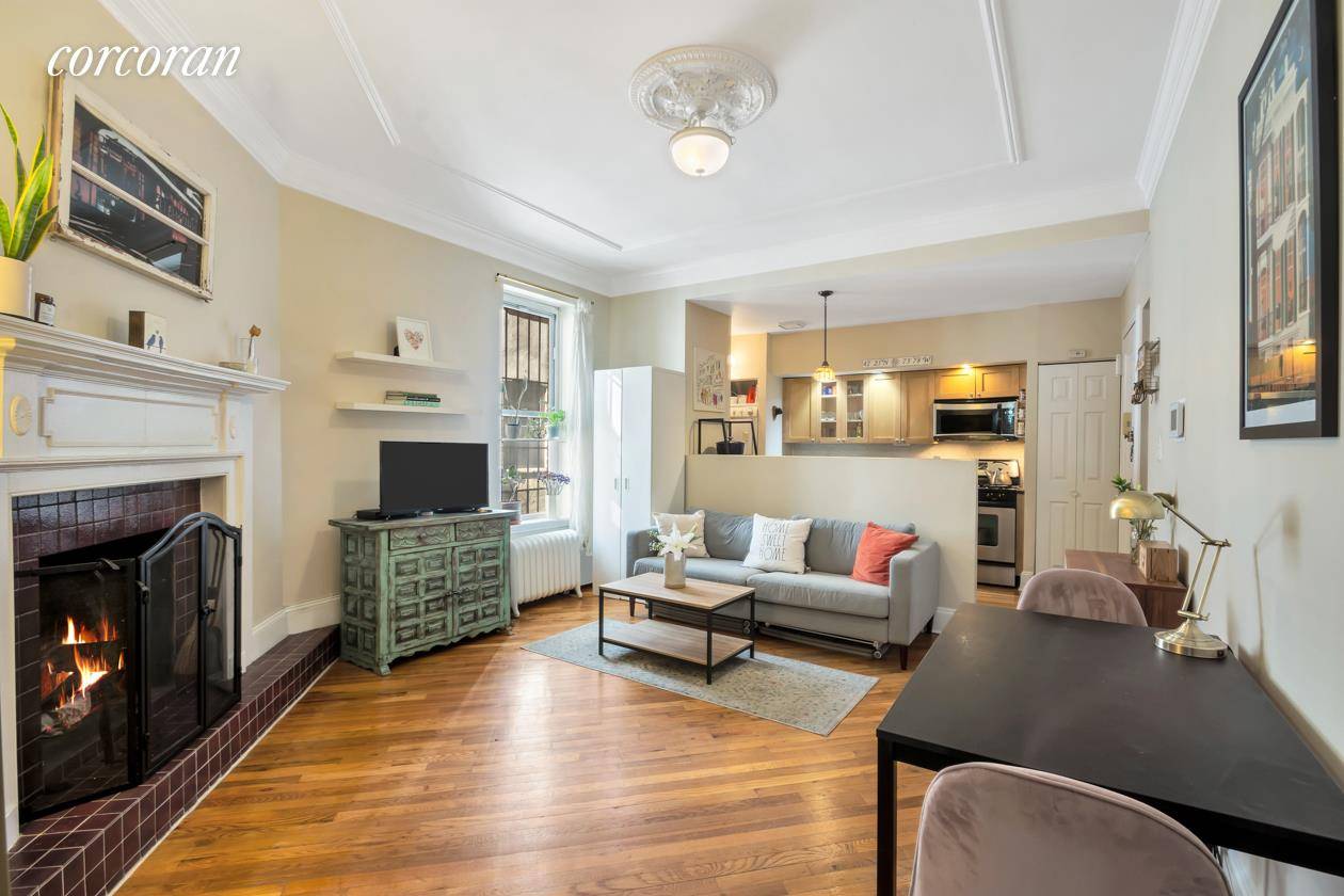 Have you ever imagined a perfectly situated Park Slope condo with working fireplace, private garden, in unit laundry, renovated kitchen and charming pre war detail ?