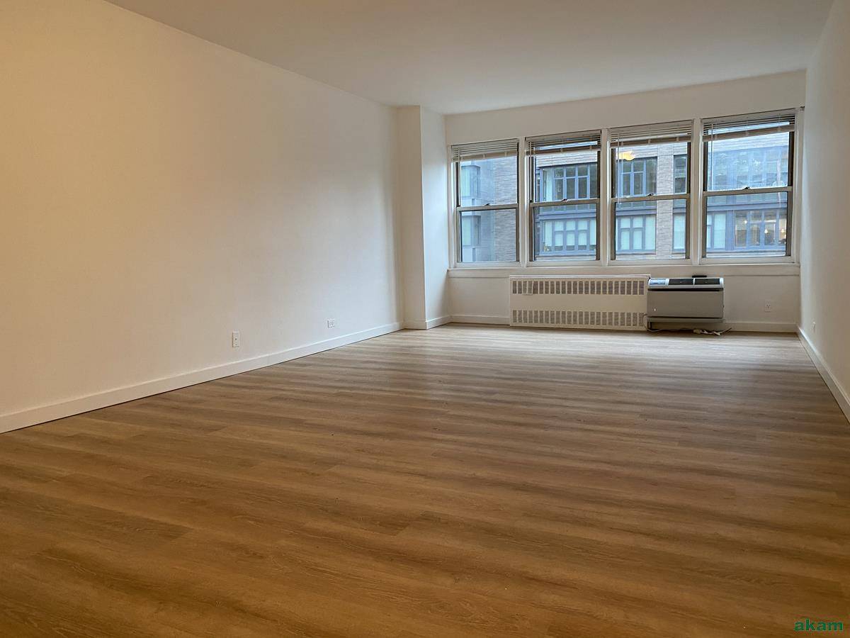 Extra large, sunny 2 bedroom, 2 bathroom condominium corner apartment with both east and west open city views.