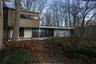 Rear view of property featuring a carport