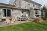 Backyard patio with access from family room and kitchen