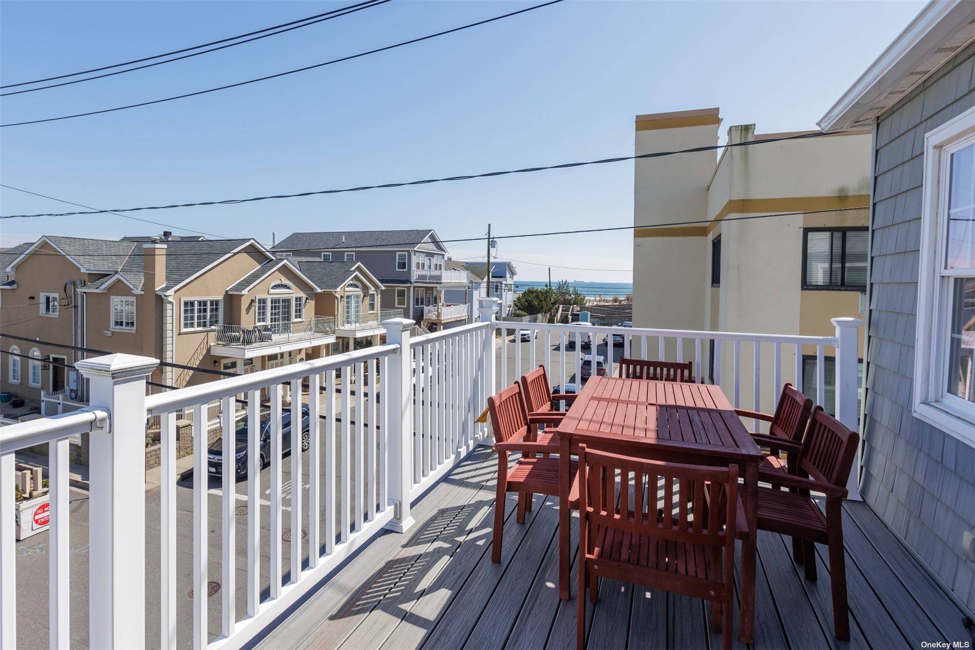 SUNDRENCHED UPDATED 3 BEDROOM, 2 BATH OCEANVIEW WITH FRONT DECK 3 HOUSES FROM THE BEACH ENTRANCE ON A WIDE BLOCK.
