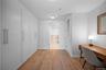 Hall with light wood-type flooring and an office area