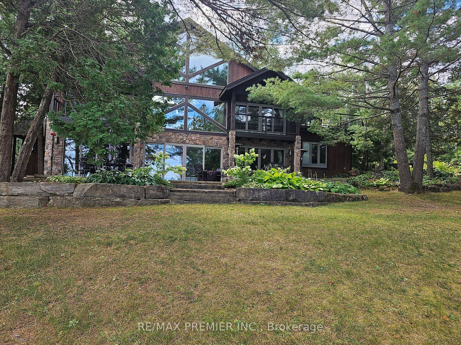 4 Season Waterfront Masterpiece Under Power of Sale by the First Mortage Holder Plus 1000 Feet of Shoreline on Paudash Lake Qver 2 Acres of Natural Wooded Area, Gated Entrance ...