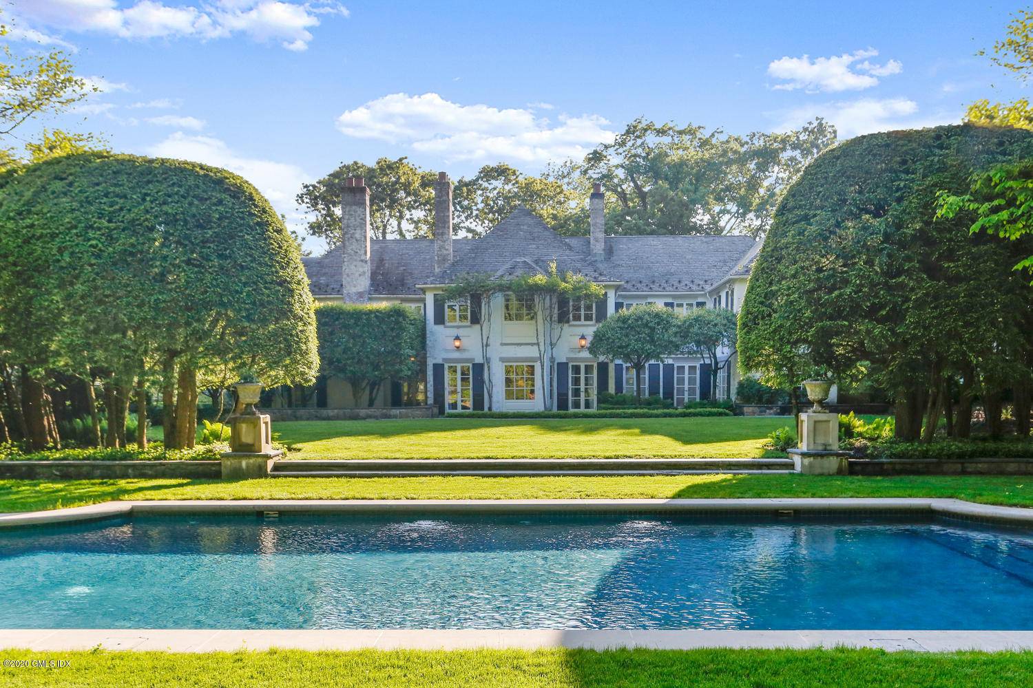 Experience the ultimate compound in this pre war French country manor home.