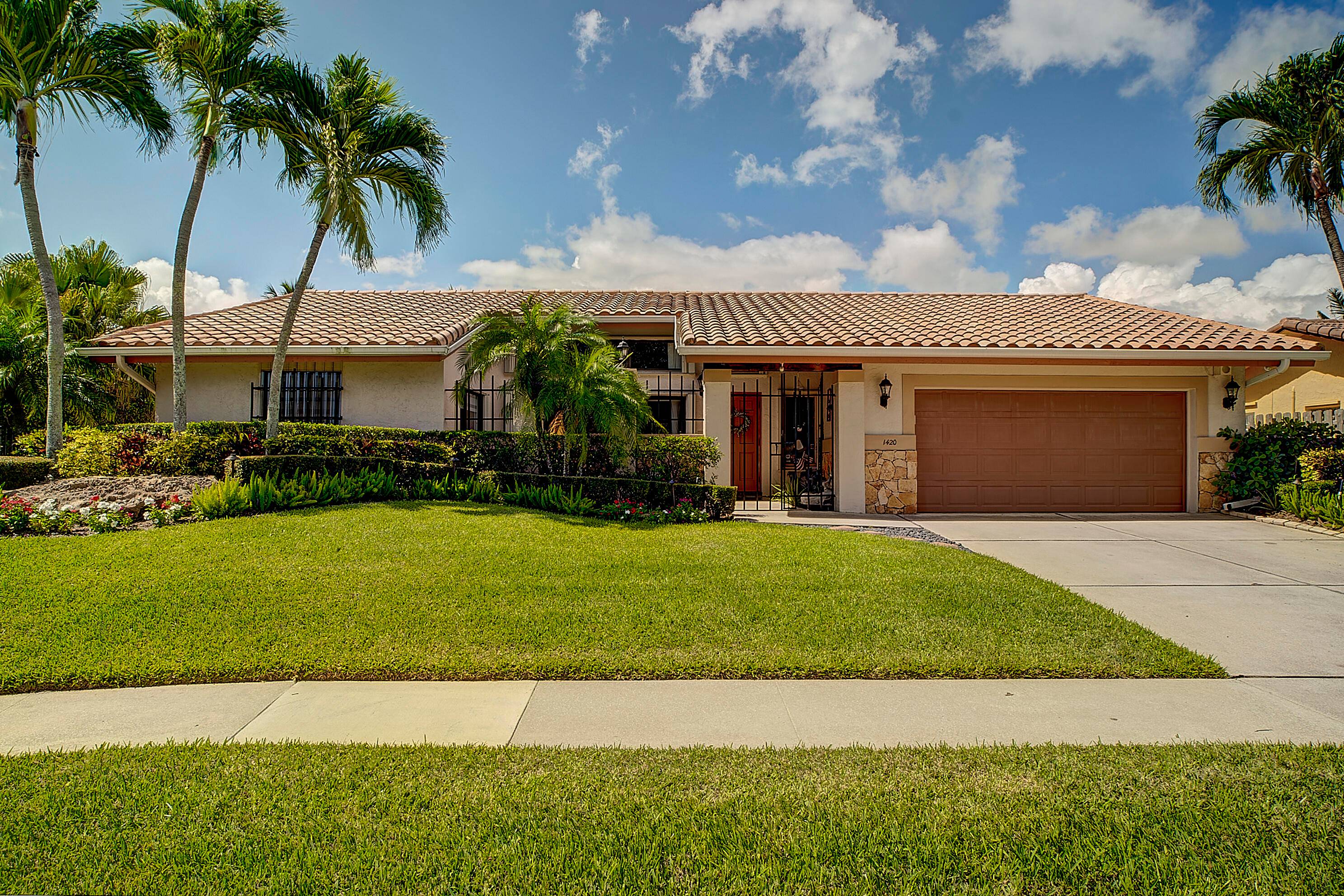 Wow only 2 homes like this in Palm Beach Farms, featuring 4 bedrooms 2 1 2 baths built in screened lanai and pool area.