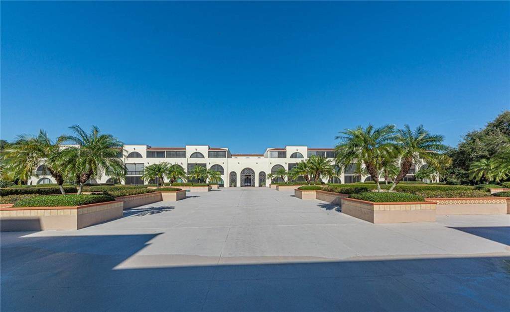 Spanish style architecture meets Vero Beach charm in this Robles del Mar 2 bedroom, 2 bathroom condo with sweeping artistic terrace overlooking courtyard and rustic gardens.