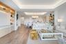 Spacious open concept living room with tongue and groove ceiling details and lighting