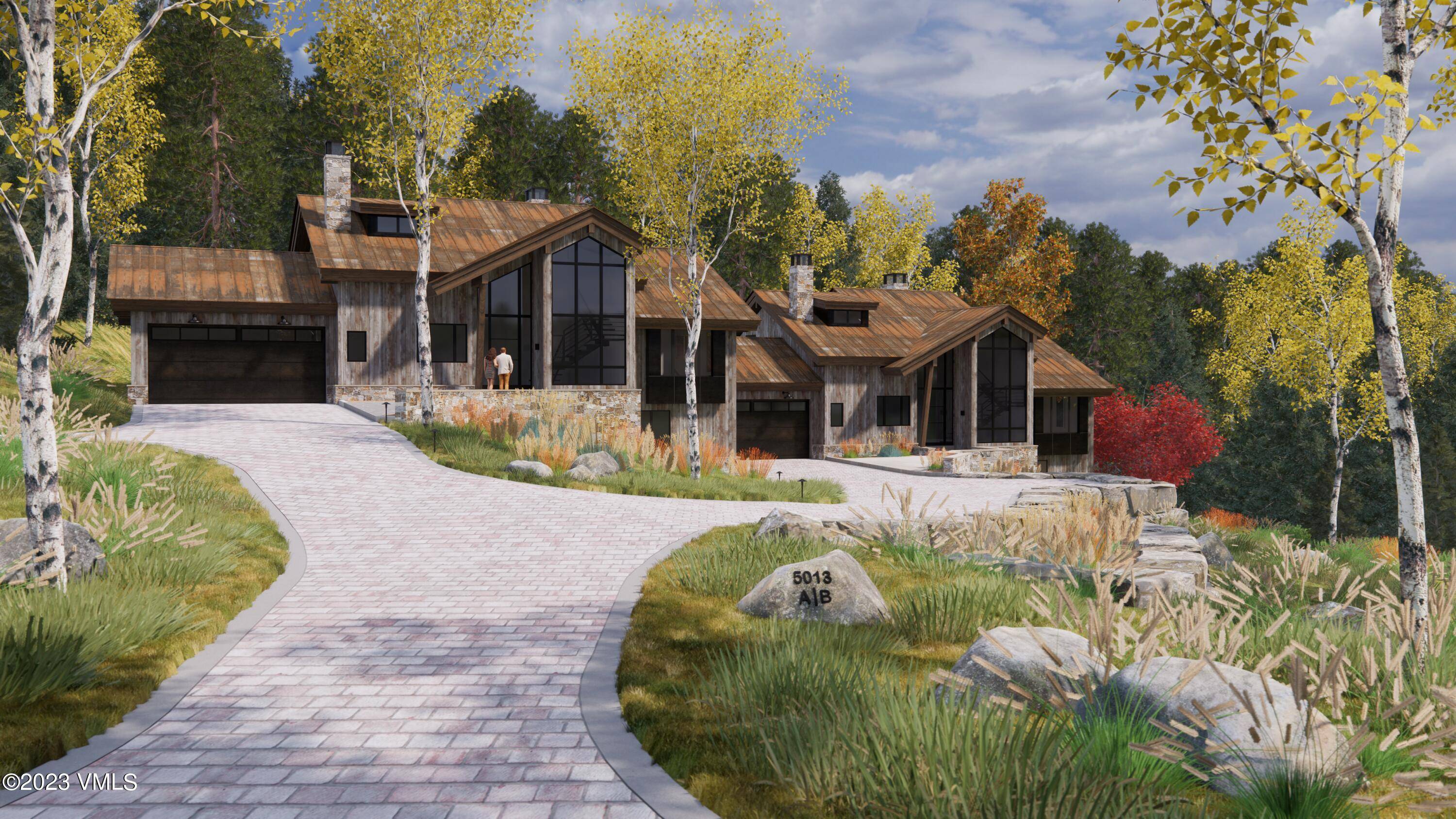 New mountain contemporary home under construction in a private alpine setting.
