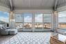 Sunroom featuring vaulted ceiling, wooden ceiling, and hardwood / wood-style flooring