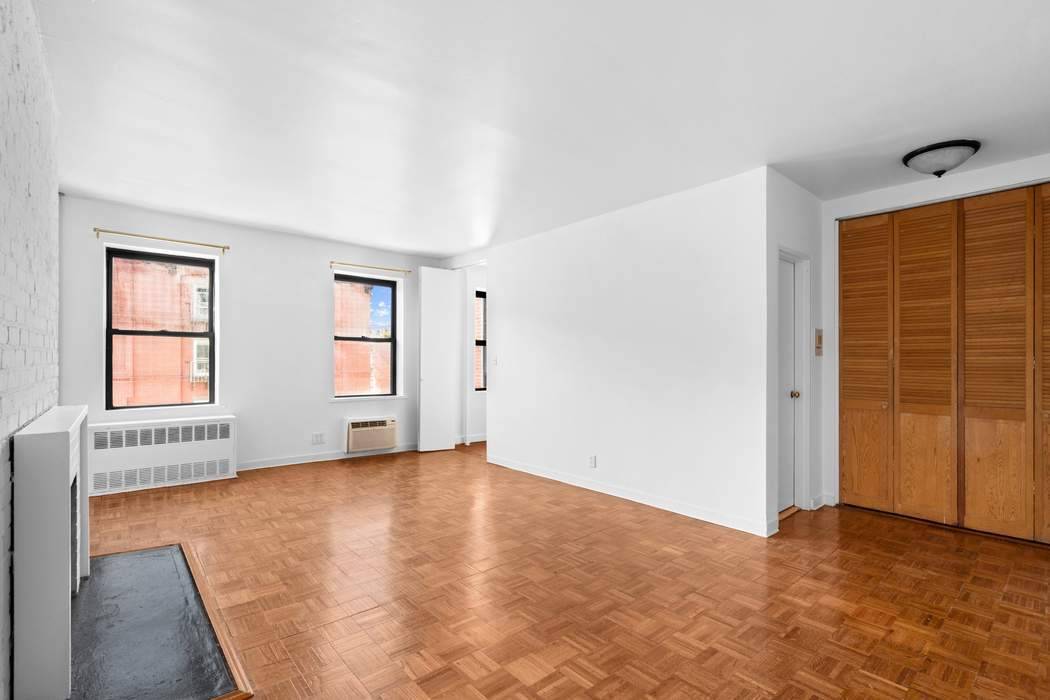 Quintessential East Village Charmer Residence 3A at 87 Saint Marks Place is a sunny one bedroom on a quiet tree lined East Village block.