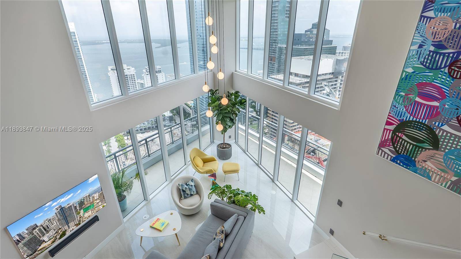 Experience elevated living in this highly remodeled 2 story duplex residence soaring 42 floors above the city at Infinity Brickell.