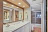 Primary Bath with Dual Sinks and Separate Commode & Tub/Shower Combo