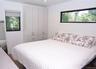 Bedroom featuring dark wood-style floors and recessed lighting