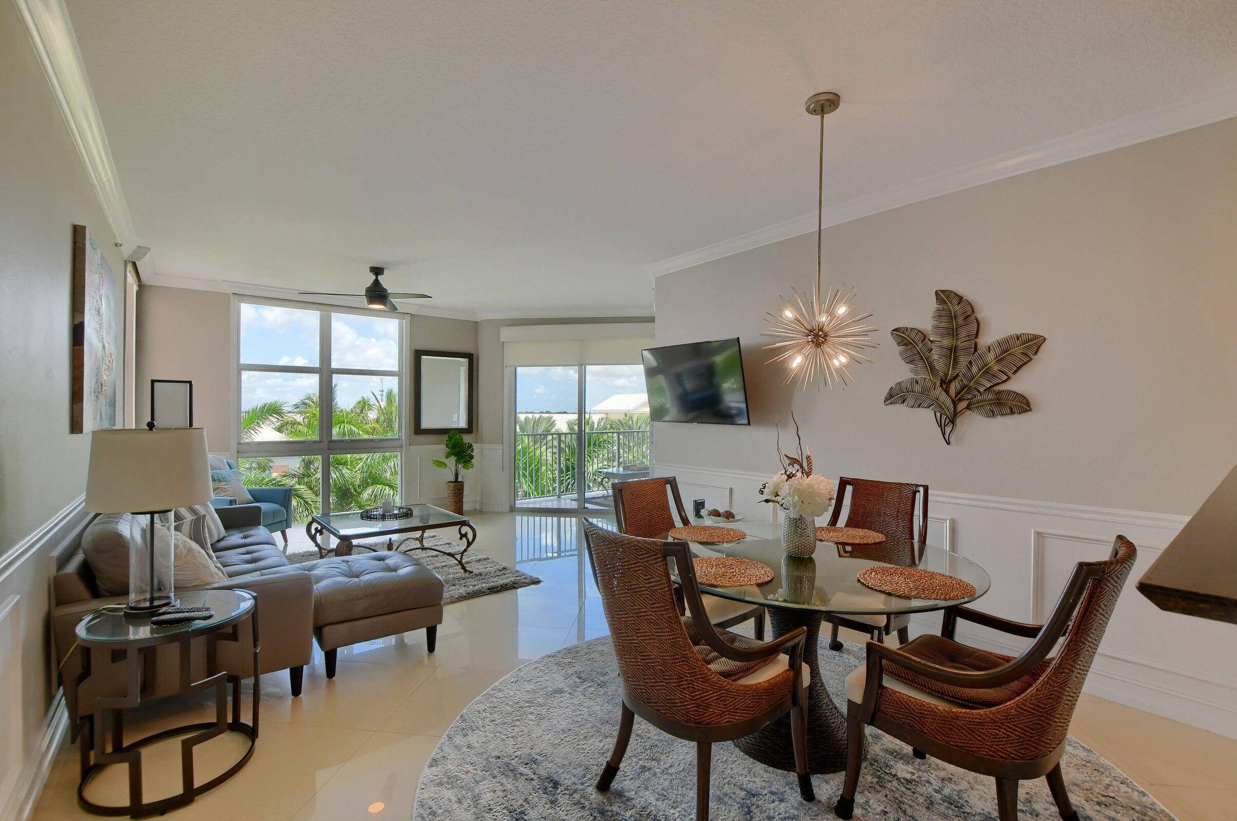 Enjoy Resort Style Living in this beautifully updated Fully Furnished and Turnkey condominium located in the sought after waterfront community, Moorings in Lantana.