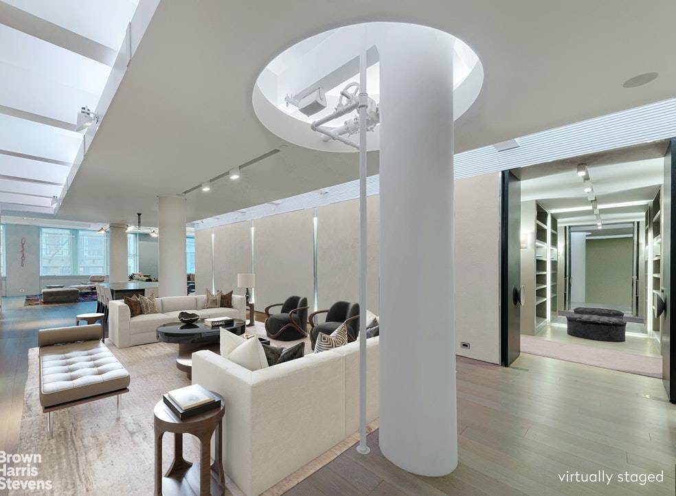 Created by award winning designer Iain Halliday, this unique, sprawling, state of the art, full floor luxury loft spans 4500 square feet with 12 foot ceilings.