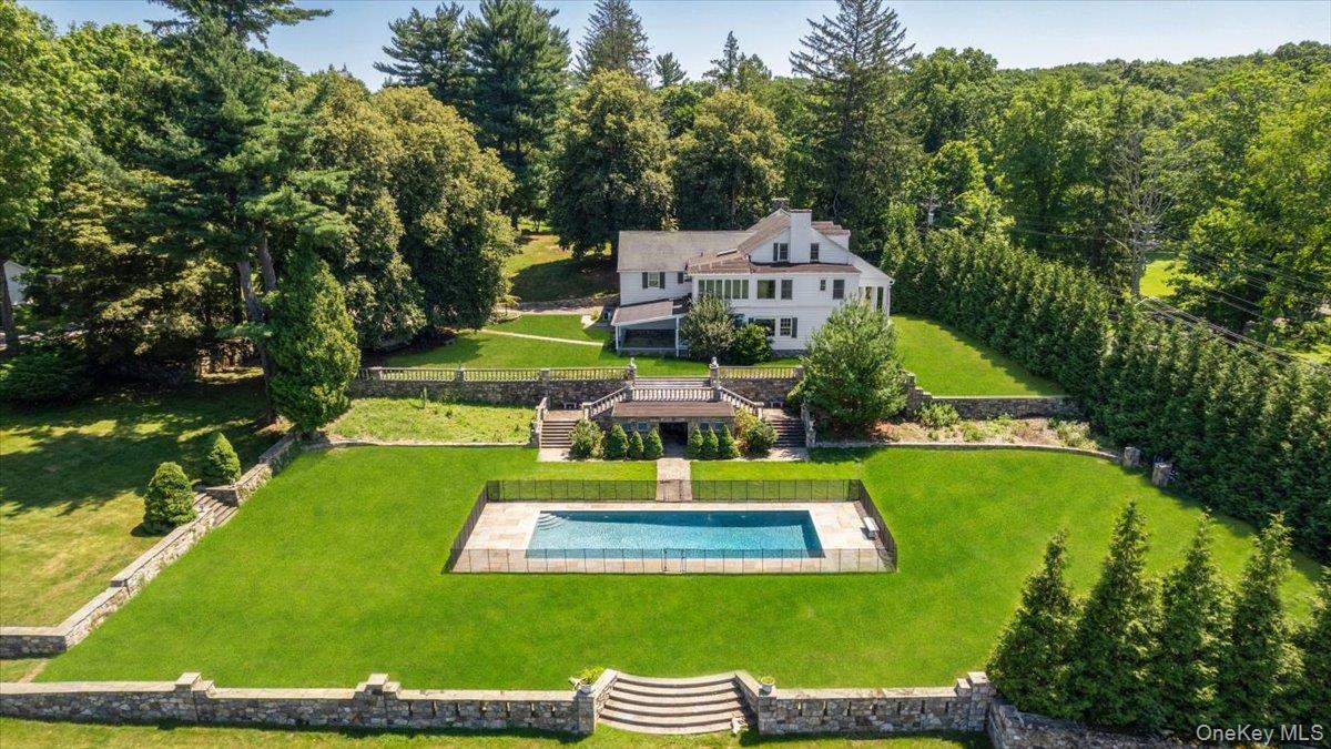 a historic country estate on 17.9 private acres with pool, terraced gardens and expansive level lawns.