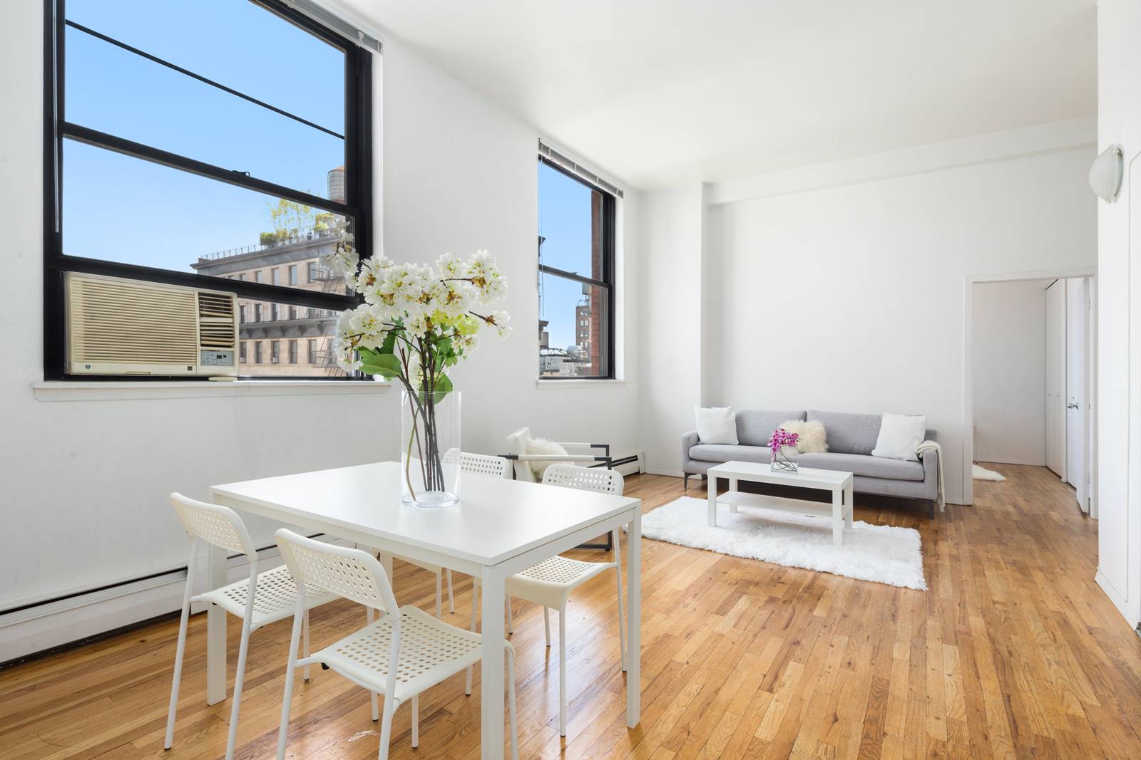 Sun Flooded Renovated One bedroom loft with massive windows and 11 ft ceilings in a full service iconic building in Noho Greenwich Village.