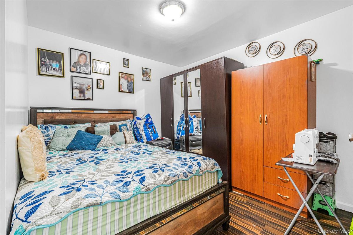 White walls complement the dark wood-finish flooring