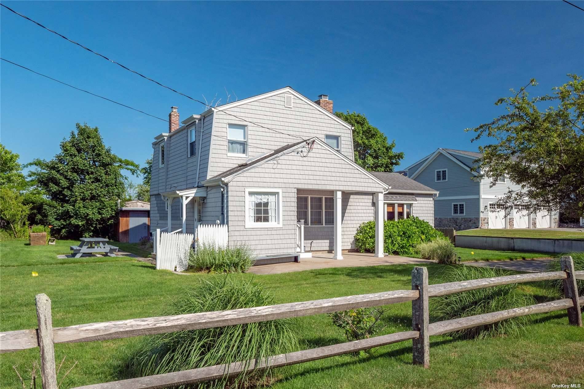 Sprawled over a bautifully landscaped yard with a private bay beach one house away, just minutes from dining and Ocean beaches sits this charming 3 Bedroom, 2 Bathroom home with ...