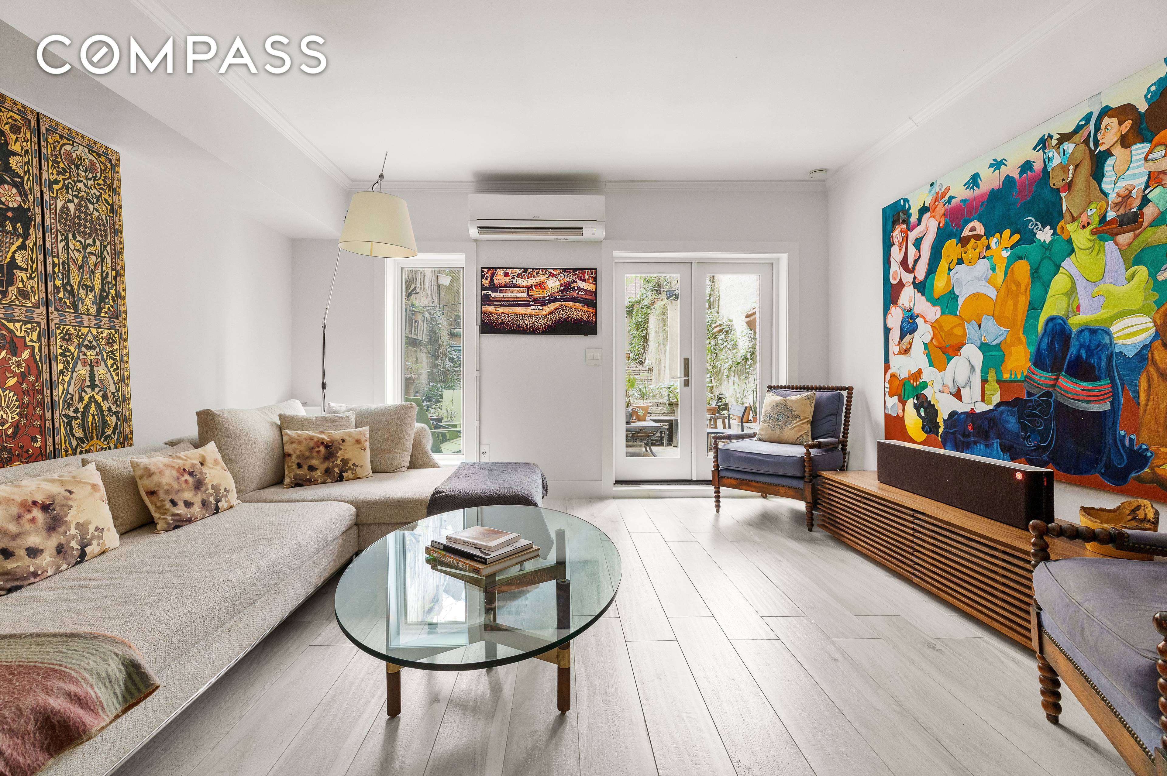 This exquisitely renovated 1 bedroom apartment with an open concept living space and expansive private garden truly has it all.