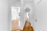 Upper level hallway with original decorative doorway cut-outs