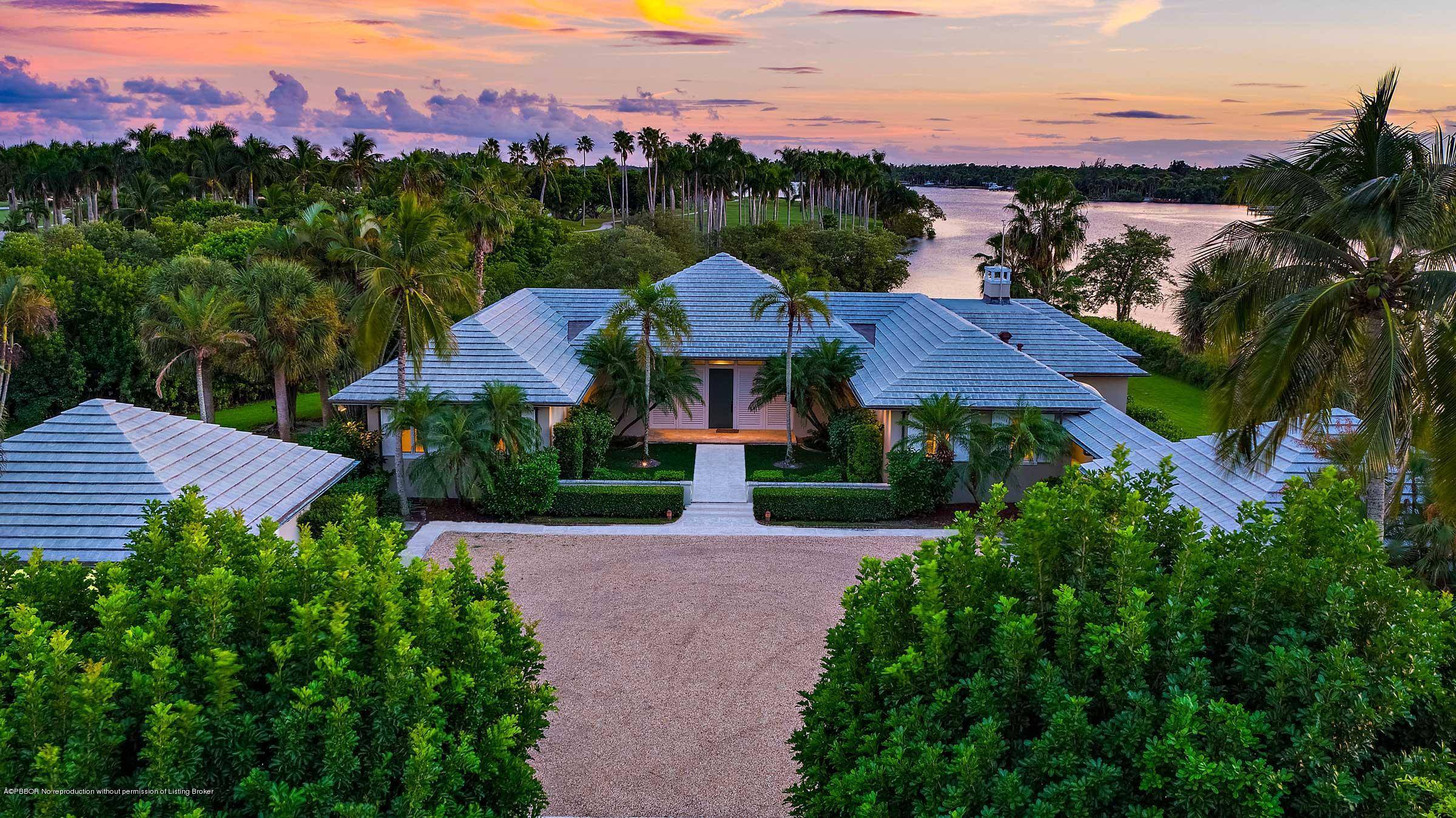 Rarely available 3. 4 acre Jupiter Island waterfront estate featuring picturesque panoramic views of the Intracoastal and the Jupiter Island Club golf.