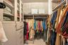 Spacious closet with carpet flooring