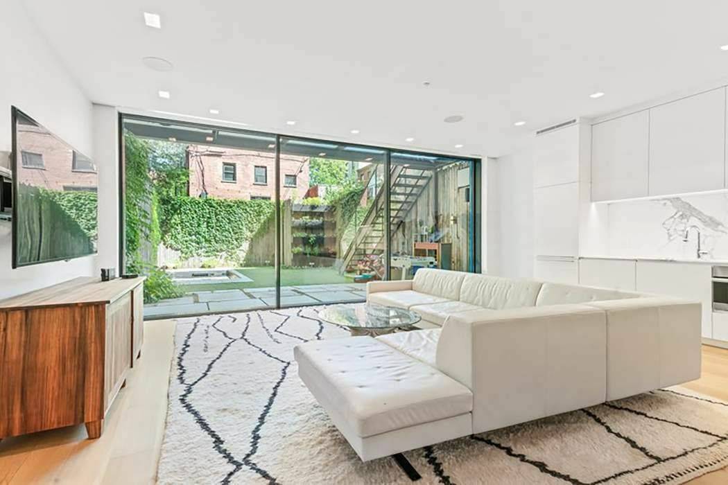 Situated in the heart of Cobble Hill sits this amazing 25' wide townhouse garden level apartment.