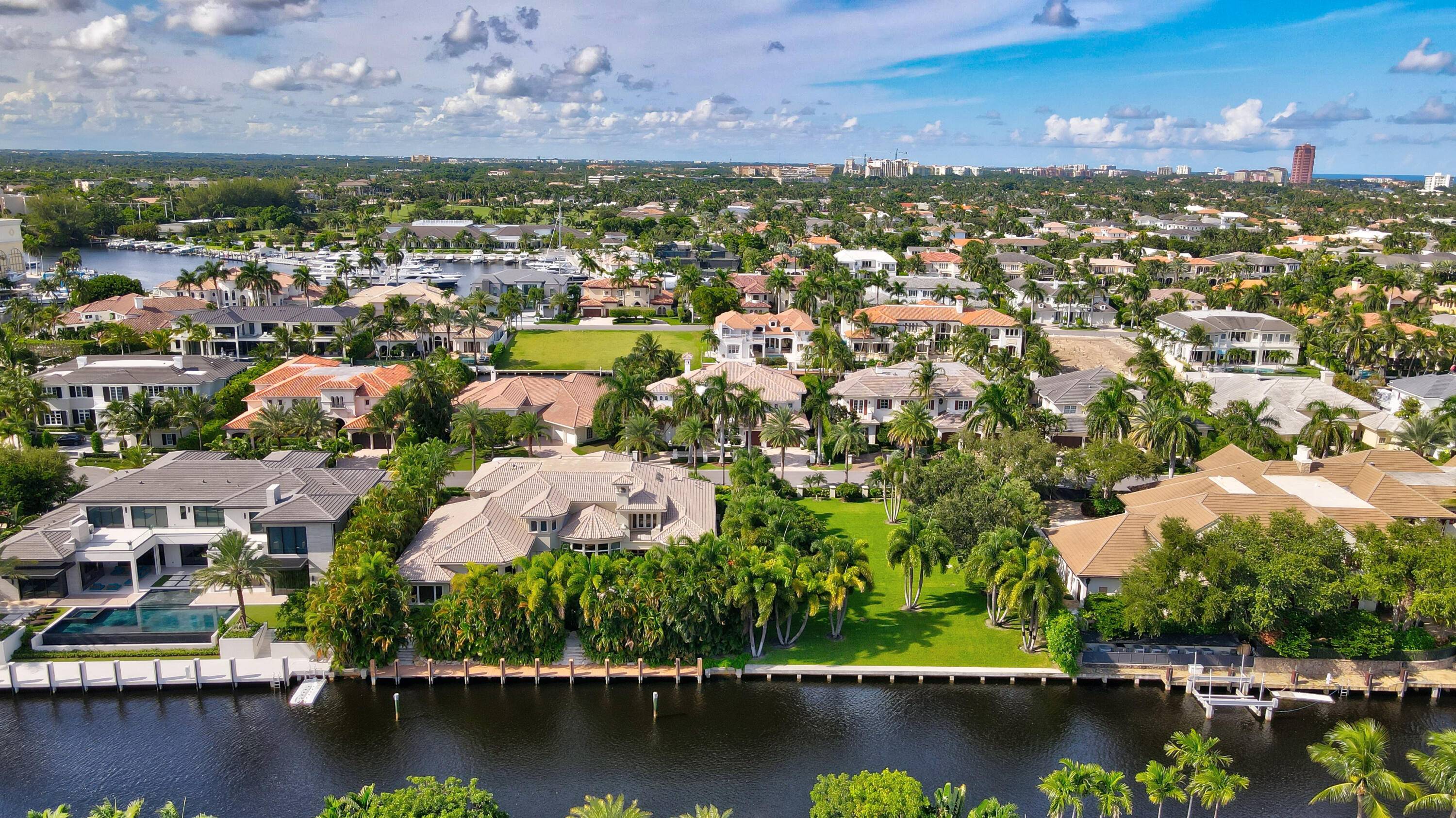 Introducing 174 West Coconut Palm Road ; an exquisite double lot estate situated in one of Boca Raton's most prestigious communities, Royal Palm Yacht Country Club.