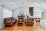 Living area featuring recessed lighting, lofted ceiling, a fireplace, light wood finished floors, and stairway