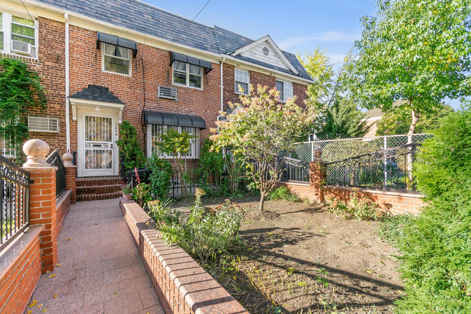 This absolutely charming solid brick townhome is everything you've been searching for.