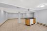 Finished lower level equipped with summer kitchen, bonus room & updated full bathroom