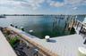 Dock area with a water view and boat lift