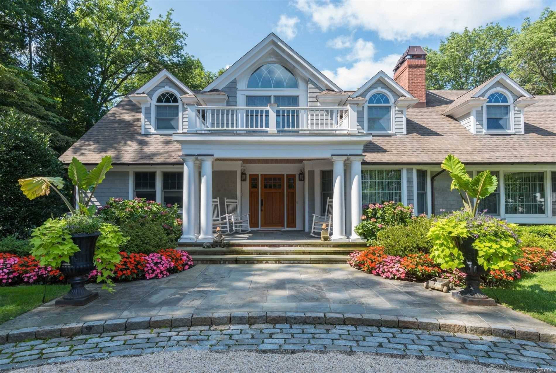 Picturesque Cedar Shingle Colonial in Cold Spring Harbor School District set back 200ft from road w well appointed mouldings amp ; copper gutters.