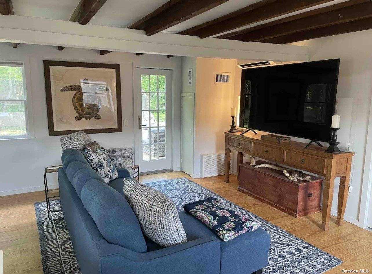 Nestled in the Eastport South Manor school district, this private one bedroom cottage in Eastport boasts exposed beams, wood floors, and an open concept seamlessly connecting the kitchen and living ...