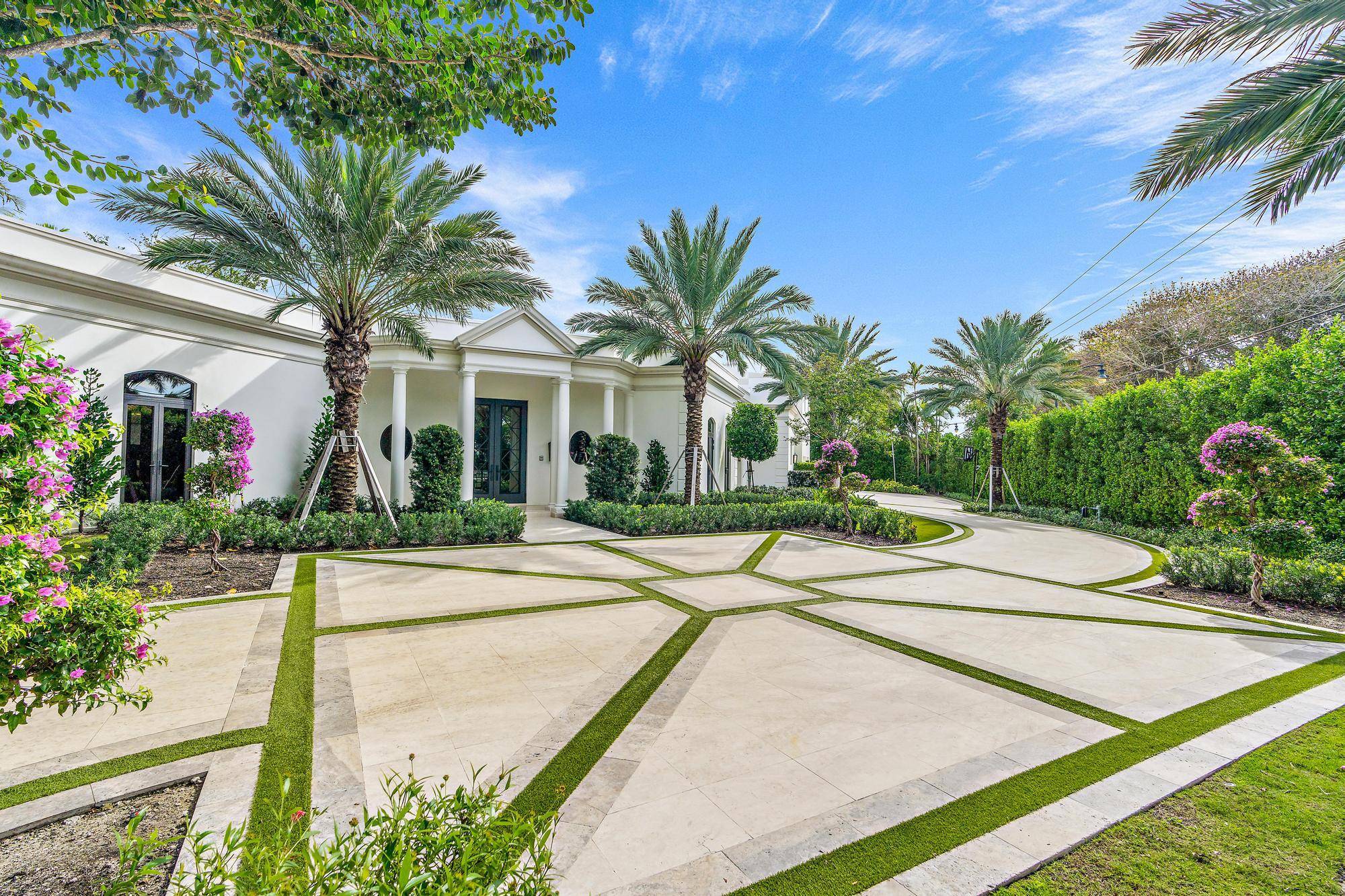 Step into this completely reimagined regency estate in the coveted Estate Section of Palm Beach.