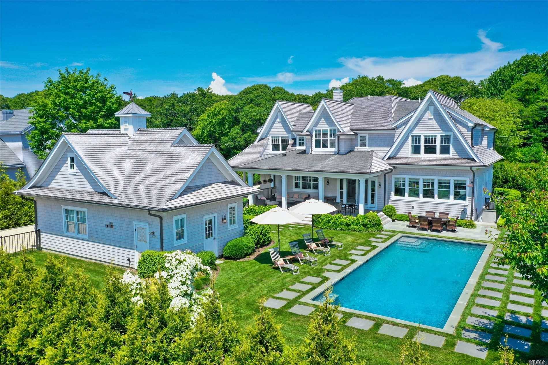 Now Listed, this Quogue South stunning post modern, features a sleek modern yet beachy interior.