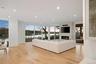Living room with a fireplace and light hardwood / wood-style floors