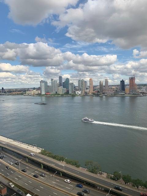 Enjoy the fabulous river views from this nicely renovated one Br Manhattan Place Condominium.