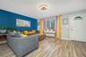 Living room featuring wood finished floors and radiator heating unit