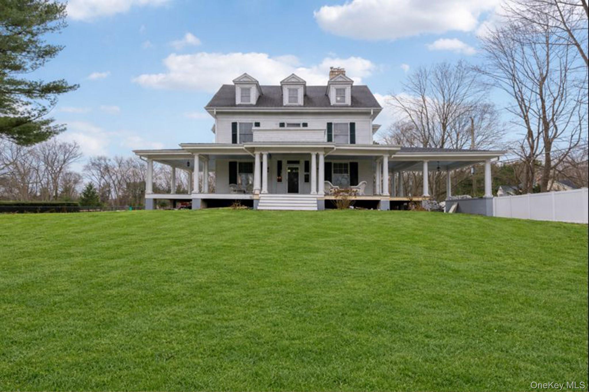 View of front of property with a large porch